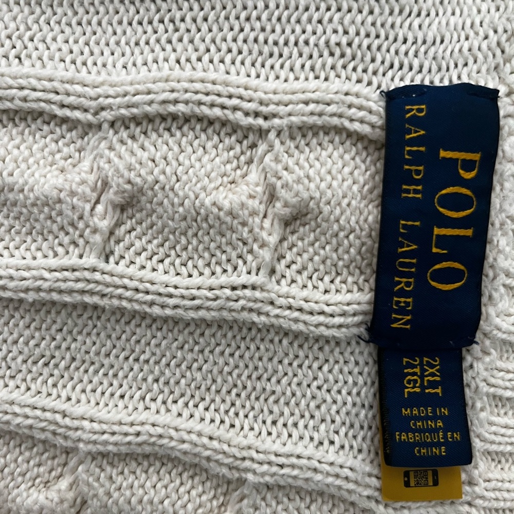 Polo Ralph Lauren white knit sweater, featuring a crewneck and a ribbed trim.